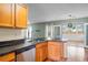 Bright kitchen features stainless appliances, wood cabinets, and a breakfast bar overlooking a sunroom at 412 Beverly Dr, Summerville, SC 29485
