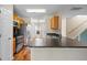 Well-equipped kitchen with stainless steel appliances and granite countertops that open up to dining area at 412 Beverly Dr, Summerville, SC 29485