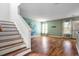 Inviting living room featuring hardwood floors, stairs, and an unique wall design at 412 Beverly Dr, Summerville, SC 29485