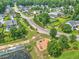 A playground is surrounded by mature trees and lush greenery in a residential neighborhood at 412 Beverly Dr, Summerville, SC 29485
