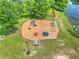 Aerial view of a playground with slides and swings set in a park like setting near a pond at 412 Beverly Dr, Summerville, SC 29485