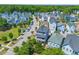 Aerial view of a colorful community with tree-lined streets and vibrant homes at 4419 Louisa Lane Ln, North Charleston, SC 29405
