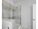 Stylish bathroom with glass shower enclosure and elegant stone mosaic tile accents at 4419 Louisa Lane Ln, North Charleston, SC 29405