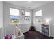 Sunlit Bedroom with white crib, dresser, and charming artwork above a neighborhood view at 4419 Louisa Lane Ln, North Charleston, SC 29405
