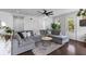 Relaxing living room featuring a sectional sofa, modern decor, and access to outdoor spaces at 4419 Louisa Lane Ln, North Charleston, SC 29405