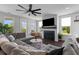 Comfortable living room with a fireplace, a large sectional sofa, and plenty of natural light at 4419 Louisa Lane Ln, North Charleston, SC 29405