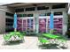 Vibrant outdoor seating area with colorful chairs and umbrellas at Paradiso at 4419 Louisa Lane Ln, North Charleston, SC 29405
