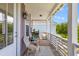 Relaxing porch with comfortable chairs, perfect for enjoying the outdoor scenery and grilling at 4419 Louisa Lane Ln, North Charleston, SC 29405