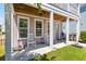 Cozy porch with rocking chairs, providing a perfect spot for relaxation at 4419 Louisa Lane Ln, North Charleston, SC 29405