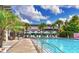 Resort-style swimming pool with lounge chairs and tropical palm trees at 4419 Louisa Lane Ln, North Charleston, SC 29405