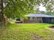 View of the backyard, house, and side trailer at 4470 Farmwood Ct, Ladson, SC 29456