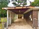 View of the brick carport featuring lattice walls and concrete floor at 4470 Farmwood Ct, Ladson, SC 29456
