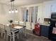 Open dining area with attractive pendant lighting and great sightlines to the connected kitchen at 4470 Farmwood Ct, Ladson, SC 29456