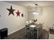 Cozy dining room with wooden table, matching chairs, and decorative wall art at 4470 Farmwood Ct, Ladson, SC 29456