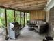Cozy covered back porch area with a grill and outdoor seating at 4470 Farmwood Ct, Ladson, SC 29456