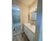Bright bathroom featuring a single sink vanity with decorative lighting at 449 Estates Dr, Walterboro, SC 29488