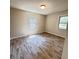 Bedroom with wood-look floors and bright natural light through two windows at 449 Estates Dr, Walterboro, SC 29488