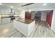 Modern kitchen with island, stainless steel appliances, and open to living space at 449 Estates Dr, Walterboro, SC 29488
