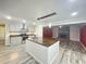 Bright kitchen features a large island with a wooden countertop and stainless steel sink at 449 Estates Dr, Walterboro, SC 29488