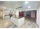 Bright kitchen features a large island with a wooden countertop and stainless steel sink at 449 Estates Dr, Walterboro, SC 29488