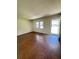 Bright living room with hardwood floors and natural light from front door at 449 Estates Dr, Walterboro, SC 29488