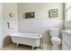 Elegant bathroom with soaking tub, tiled walls, and traditional fixtures creates a relaxing atmosphere at 4626 O'Hear Ave, North Charleston, SC 29405