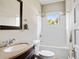 Bright bathroom featuring a tub, shower, and granite vanity with a framed mirror at 4626 O'Hear Ave, North Charleston, SC 29405