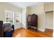 Bright bedroom featuring polished wood floors, vintage furniture, and natural light at 4626 O'Hear Ave, North Charleston, SC 29405