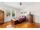 Bedroom features ample natural light, hardwood floors, and classic décor at 4626 O'Hear Ave, North Charleston, SC 29405