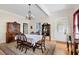 This traditional dining room has a vintage rug, chandelier, and antique furniture at 4626 O'Hear Ave, North Charleston, SC 29405