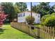 Charming two-story home with manicured lawn, wooden fence, and mature trees at 4626 O'Hear Ave, North Charleston, SC 29405