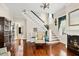 Inviting foyer with staircase, gleaming hardwood floors, and view to the living room at 4626 O'Hear Ave, North Charleston, SC 29405