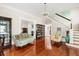 Spacious living room featuring hardwood floors, elegant staircase, and lots of natural light at 4626 O'Hear Ave, North Charleston, SC 29405