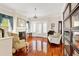 Hardwood floors, vintage chairs and decor give this living room charm and character at 4626 O'Hear Ave, North Charleston, SC 29405