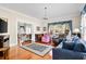 Bright and open living room with classic accents and hardwood flooring at 4626 O'Hear Ave, North Charleston, SC 29405