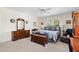 This main bedroom offers a spacious layout, soft carpet, and natural light at 4626 O'Hear Ave, North Charleston, SC 29405