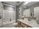 Bathroom features a vanity with mirror, a shower/tub combo, and neutral finishes at 464 White Magnolia St, Moncks Corner, SC 29461