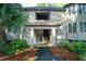 Condominium entrance with stairs to upper units, light siding, and inviting curb appeal creates a welcoming first impression at 4856 Green Dolphin Way # Share 8, Kiawah Island, SC 29455