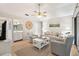 Inviting living room with comfortable seating, a ceiling fan, and ample natural light creates a warm and relaxing environment at 4856 Green Dolphin Way # Share 8, Kiawah Island, SC 29455