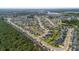 Expansive aerial view of a residential community with tree-lined streets and well-kept homes at 491 Foxbank Plantation Blvd, Moncks Corner, SC 29461