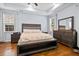 Spacious bedroom features a large bed, wood floors, and abundant natural light at 491 Foxbank Plantation Blvd, Moncks Corner, SC 29461