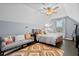 Cozy bedroom with a ceiling fan, comfortable seating, and natural light from the window at 491 Foxbank Plantation Blvd, Moncks Corner, SC 29461