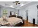 Bright bedroom with tray ceiling, large bed, and natural light from multiple windows at 491 Foxbank Plantation Blvd, Moncks Corner, SC 29461