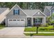 Beautiful home with gray siding, a well-kept lawn, and an attached garage in a Gathering-friendly neighborhood at 491 Foxbank Plantation Blvd, Moncks Corner, SC 29461
