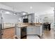 Modern kitchen featuring granite countertops, stainless steel appliances, and an open view into the living room at 491 Foxbank Plantation Blvd, Moncks Corner, SC 29461