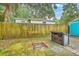 Inviting backyard fire pit area with a brick patio and wood storage at 4928 Durant Ave, North Charleston, SC 29405