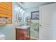 Well-lit bathroom featuring a granite vanity and mirror, complemented by decor and fixtures at 4928 Durant Ave, North Charleston, SC 29405