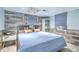 Charming bedroom featuring a rustic accent wall, stylish furnishings, and neutral decor at 4928 Durant Ave, North Charleston, SC 29405