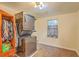 Functional laundry room with a stacked washer and dryer and ample storage space at 4928 Durant Ave, North Charleston, SC 29405