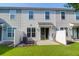 View of the home's backyard featuring a patio and grassy lawn at 4964 Hay Bale Ct, Summerville, SC 29485